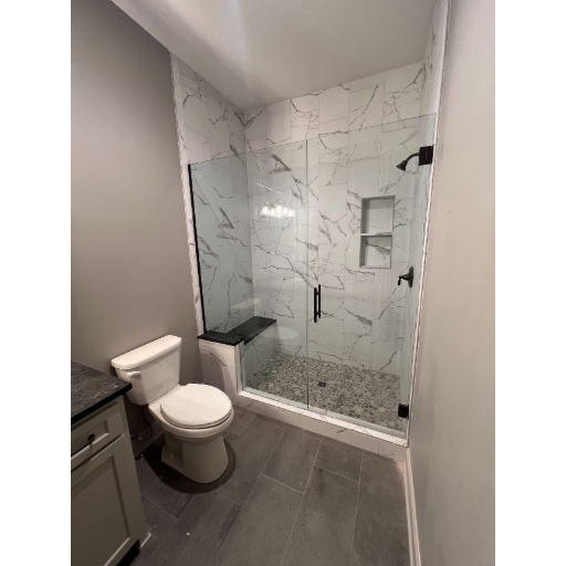 Heavy glass frameless swing door with fixed panel in alcove