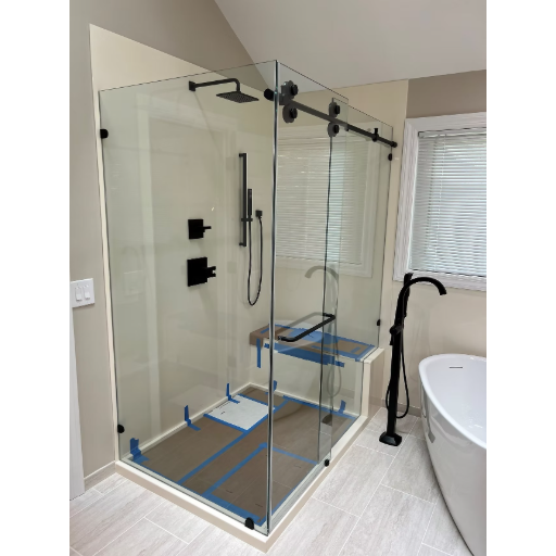 Titan series frameless sliding enclosure with black hardware and glass shelves